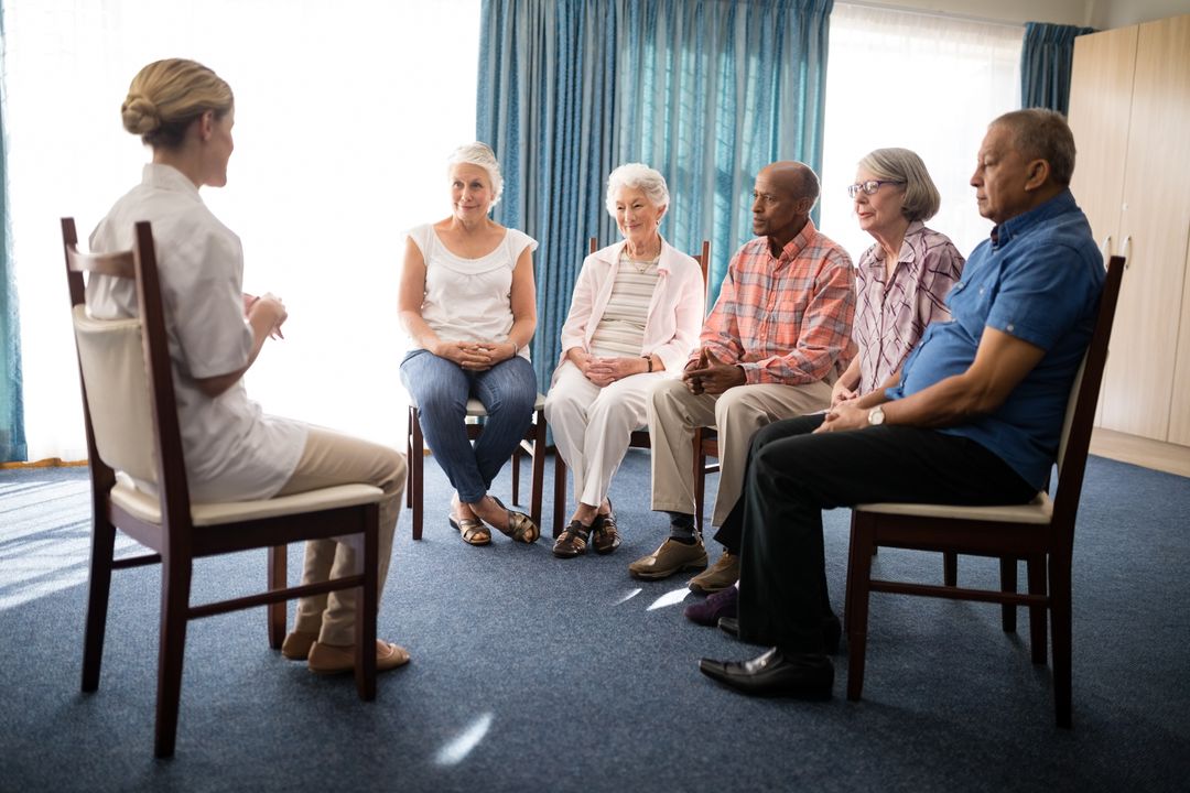 Female Doctor Leading Group Therapy Session with Seniors - Free Images, Stock Photos and Pictures on Pikwizard.com