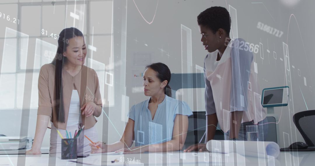 Diverse Women Analyzing Financial Data in Modern Office