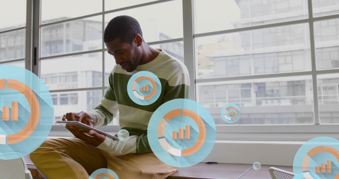 Businessman Using Tablet with Data Icons in Office Setting