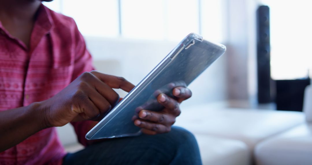 Focused African American Professional Using Tablet in Modern Office