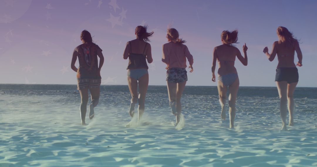 Diverse Group of Female Friends Running in Ocean
