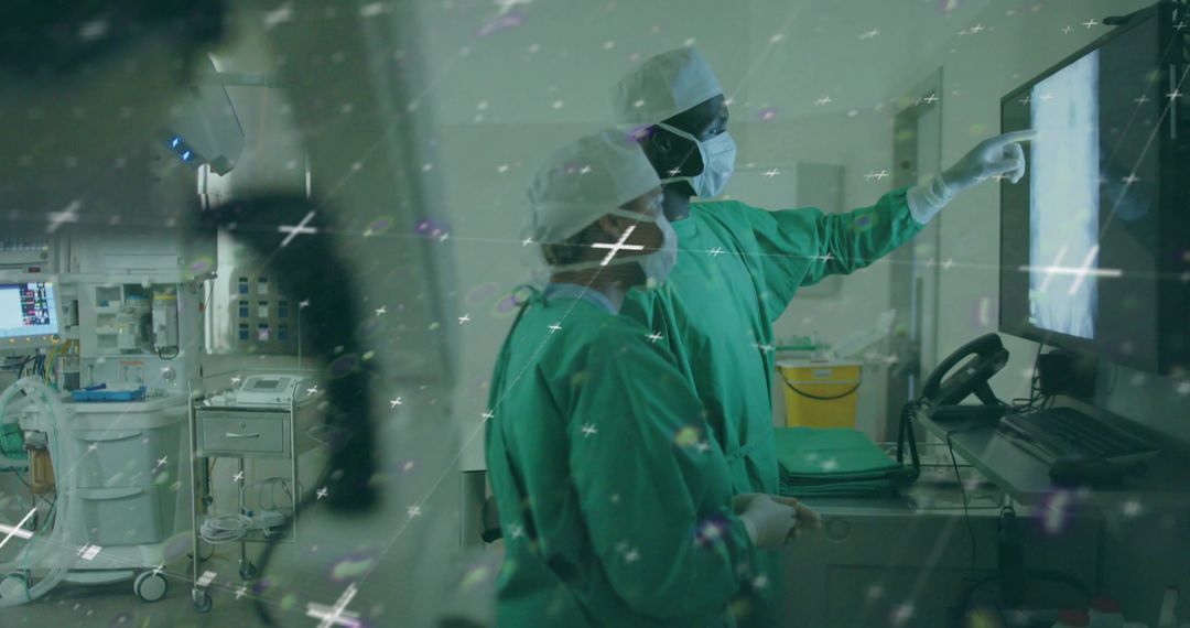 Surgeons Analyzing Medical Results on Monitor in Operating Room