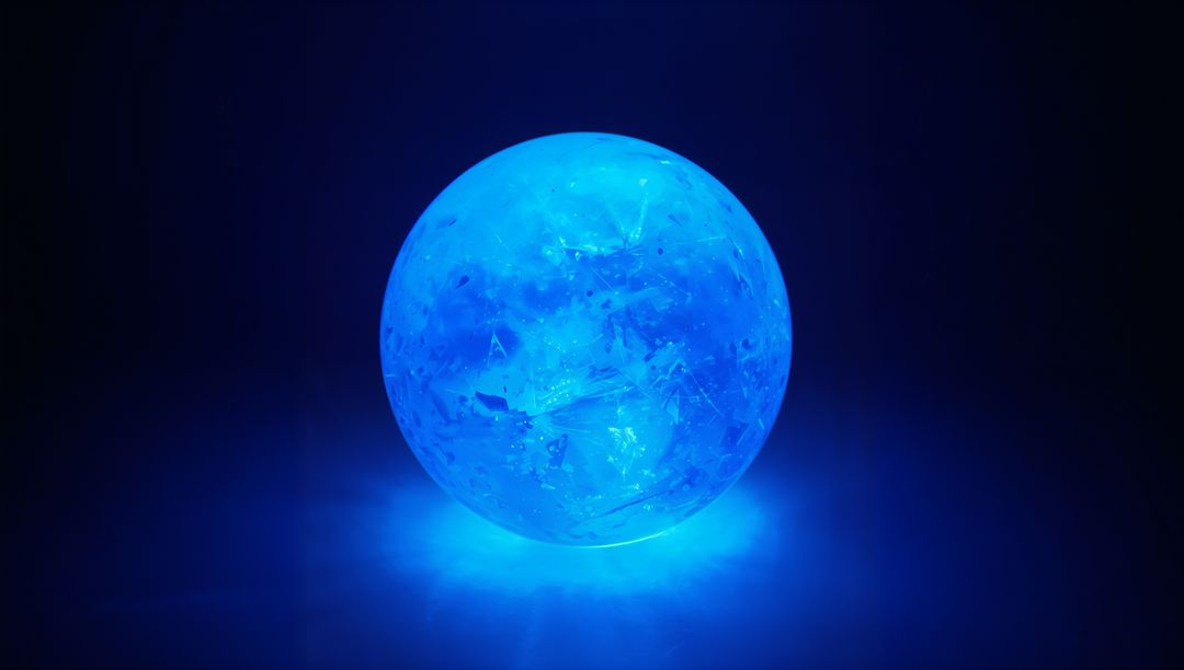 Futuristic Blue Glowing Sphere in Dark Studio Space