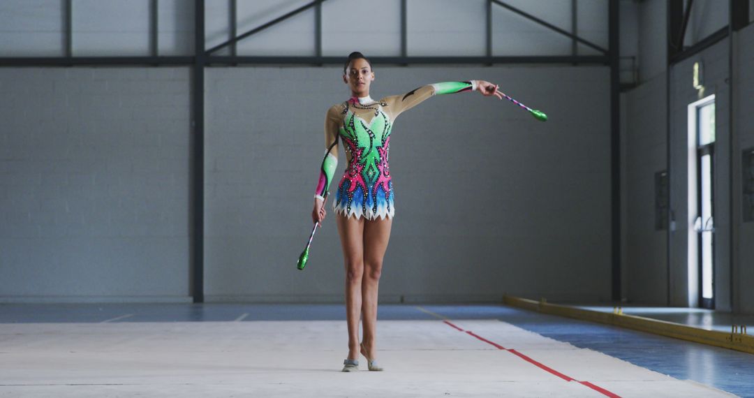 Female Gymnast Practicing Rhythmic Gymnastics in Training Facility - Free Images, Stock Photos and Pictures on Pikwizard.com