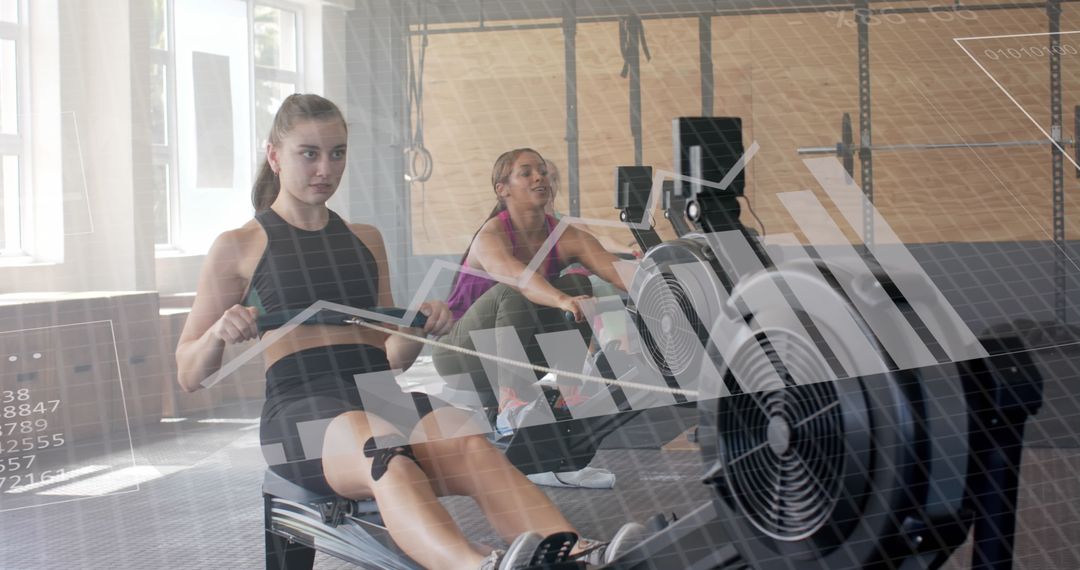 Women Exercising on Rowing Machines with Digital Data Overlay