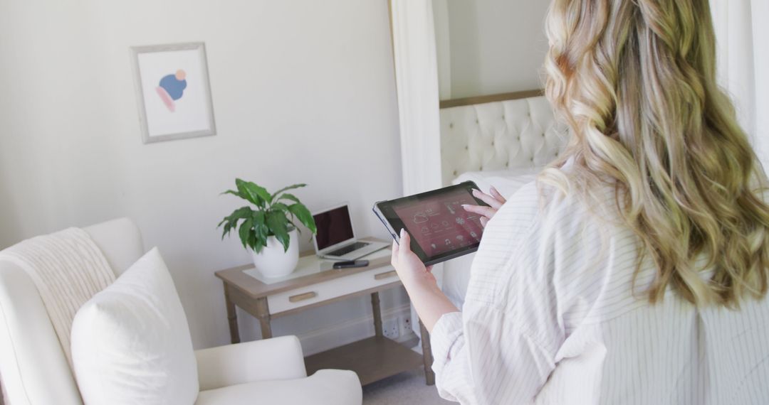 Woman Using Digital Tablet in Home Office - Free Images, Stock Photos and Pictures on Pikwizard.com