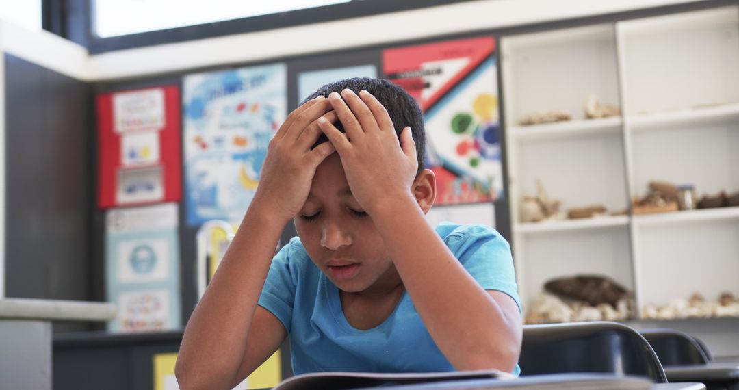 Student Concentrating on Studies at School Desk in Classroom Environment