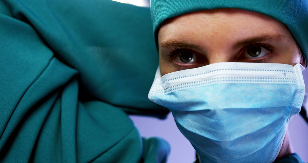 Surgeon Preparing for Surgery with Protective Face Mask - Free Images, Stock Photos and Pictures on Pikwizard.com