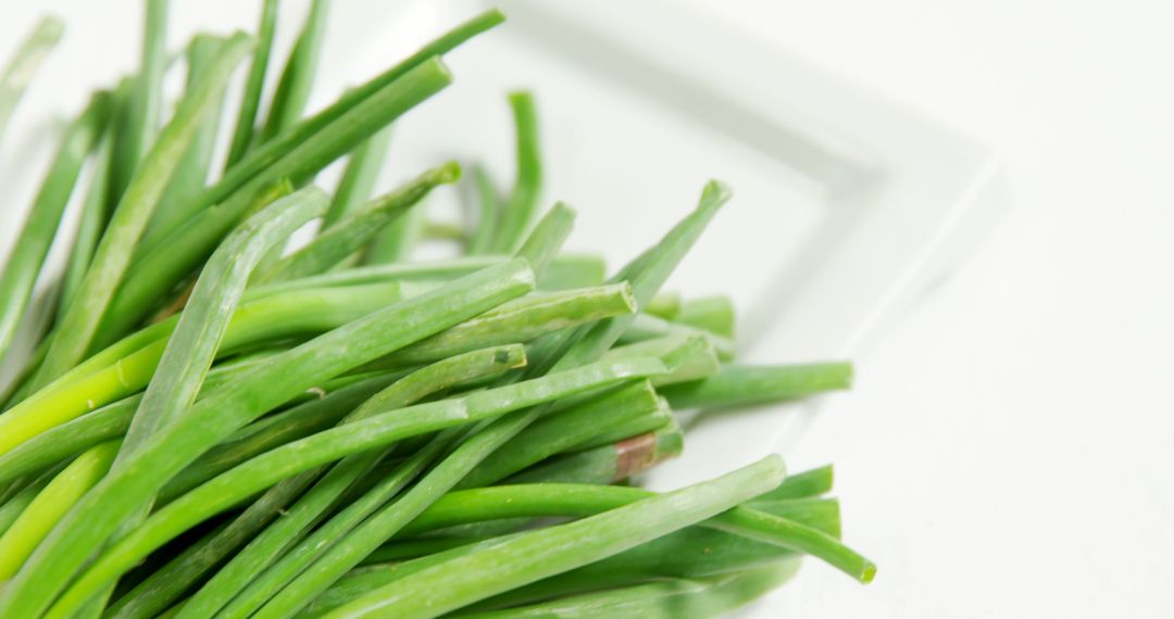 Fresh Green Scallions on White Background - Free Images, Stock Photos and Pictures on Pikwizard.com