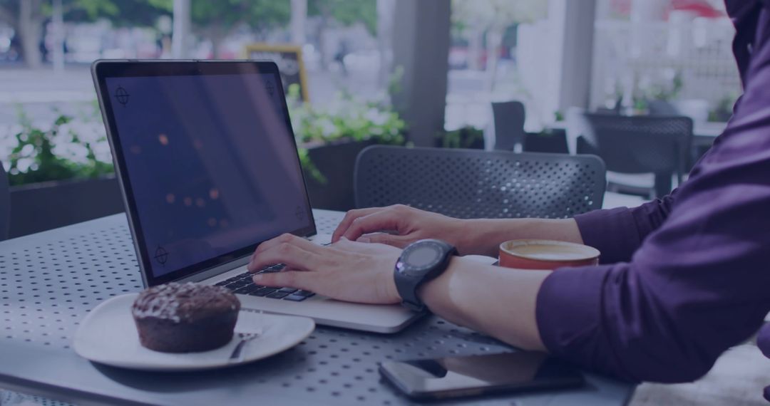 Modern Professional Working Outdoors with Laptop at Cafe