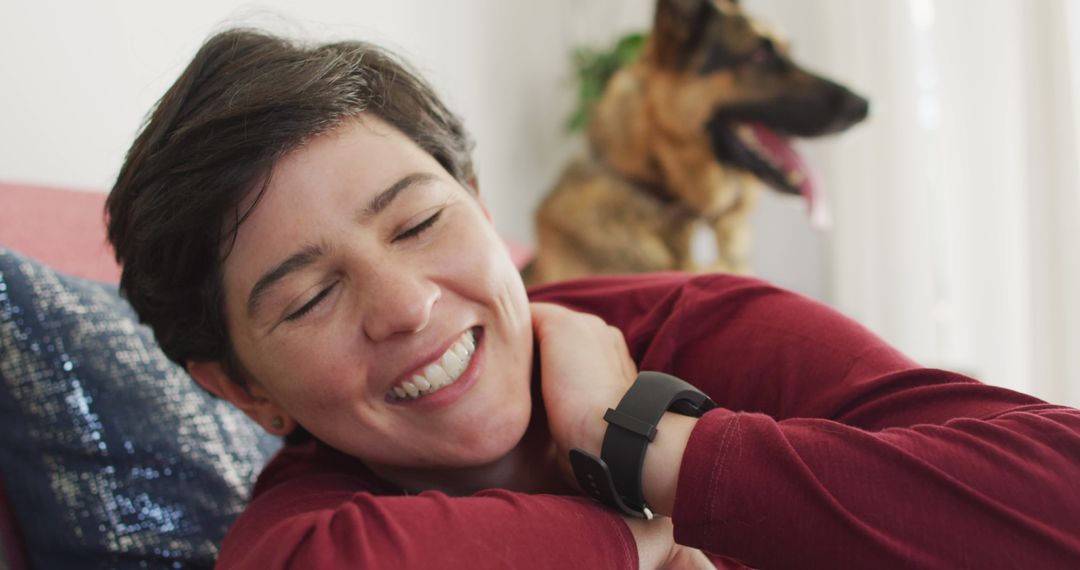 Woman Relaxing at Home with Dog in Background - Free Images, Stock Photos and Pictures on Pikwizard.com