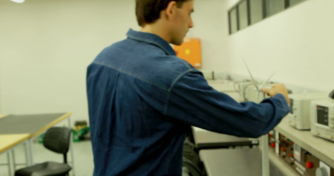 Technician Calibrating Technical Devices in Laboratory - Free Images, Stock Photos and Pictures on Pikwizard.com