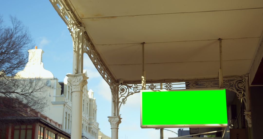 Blank Green Sign Under Urban Building Canopy - Free Images, Stock Photos and Pictures on Pikwizard.com