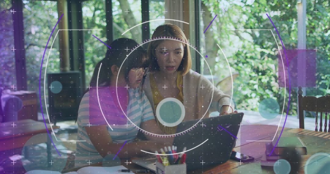 Mother and Daughter Collaborating in Bright Home Workspace