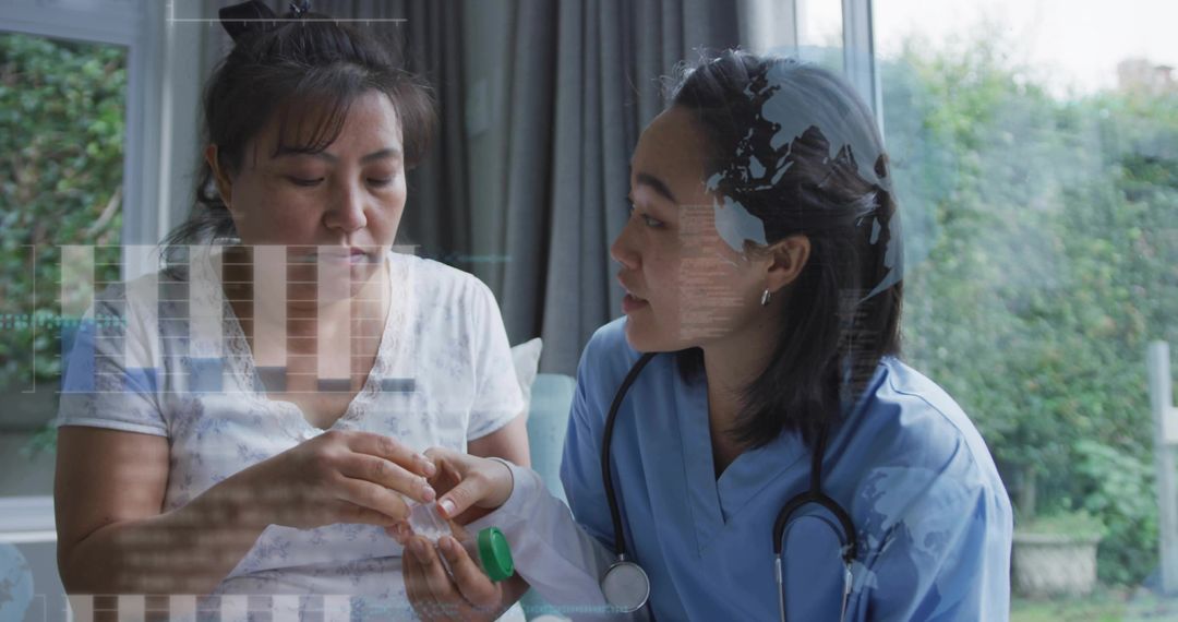 Nurse holding pill container explaining dosage to patient during home consultation