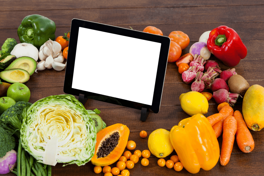 Transparent Digital Tablet Amidst Fresh Fruits and Vegetables