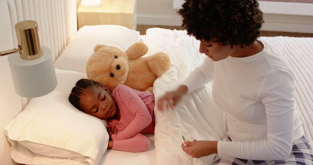 Mother Checking Sleeping Daughter's Temperature in Cosy Bedroom
