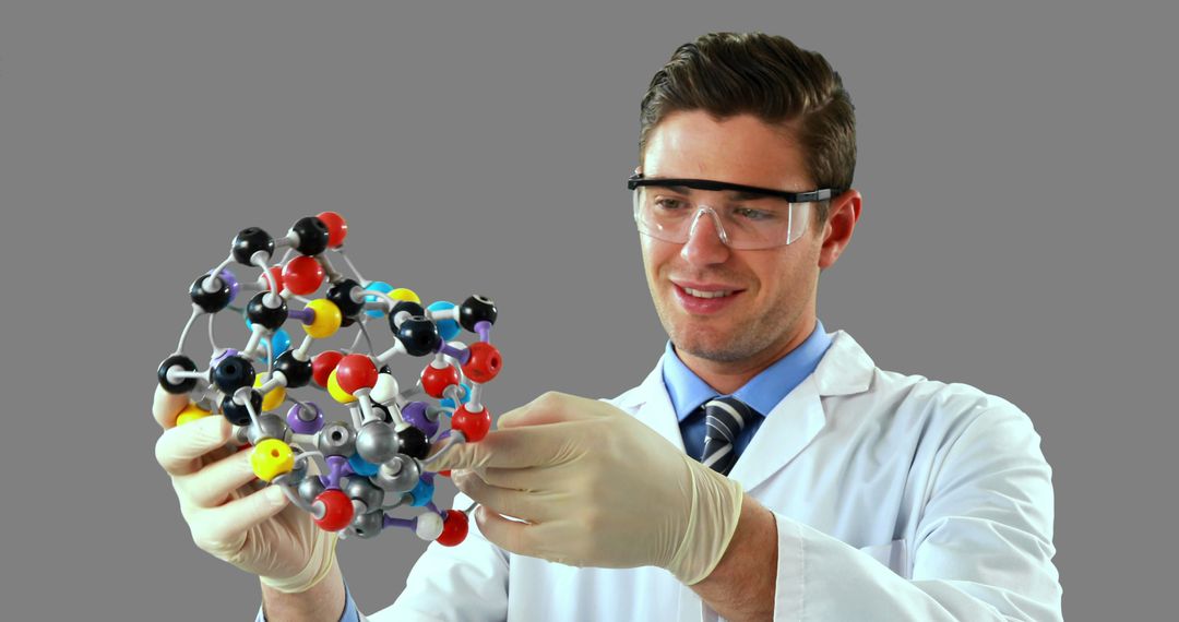 Male Scientist Examining Molecular Model in Laboratory - Free Images, Stock Photos and Pictures on Pikwizard.com