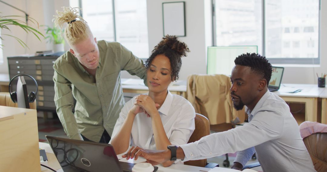 Diverse Team Collaborating on Business Project in Creative Office
