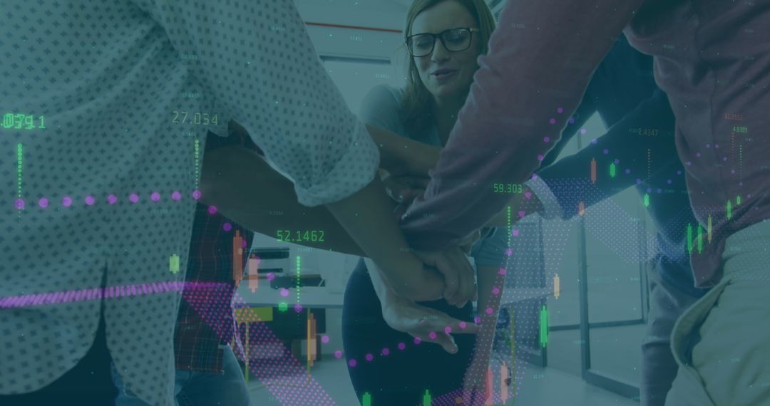 Diverse Colleagues Stacking Hands with Financial Data Overlay