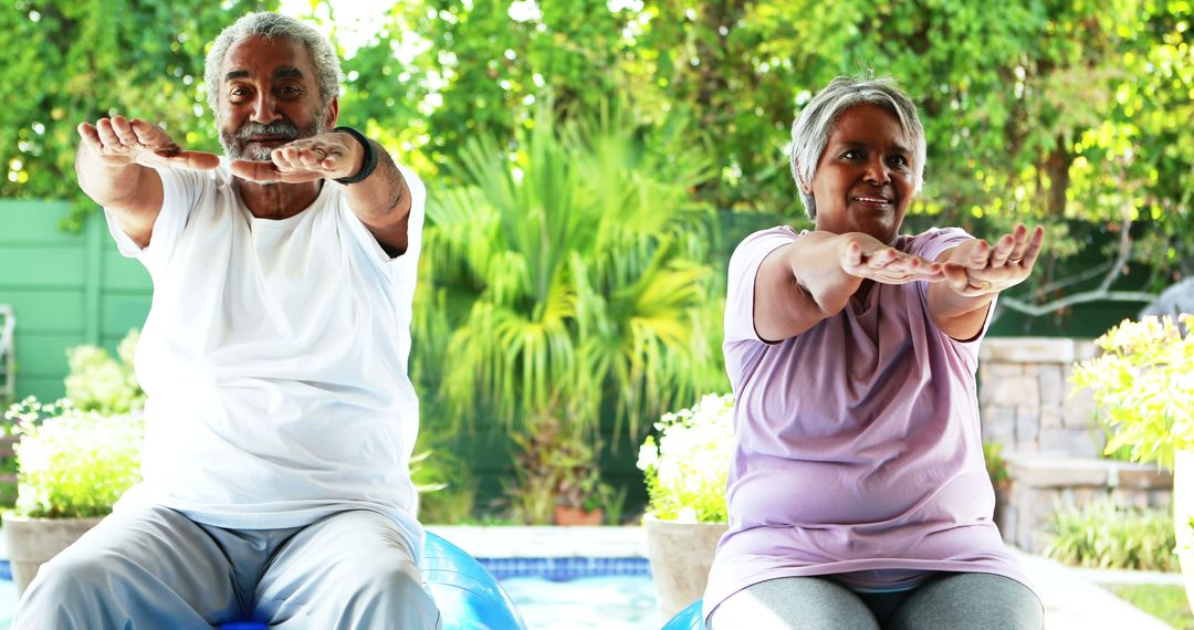 Senior African American Couple Exercising on Yoga Balls Outdoors - Free Images, Stock Photos and Pictures on Pikwizard.com