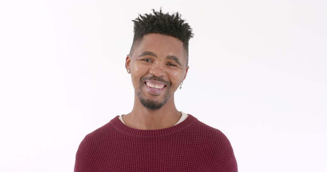 Smiling Man in Casual Sweater Exuding Positivity