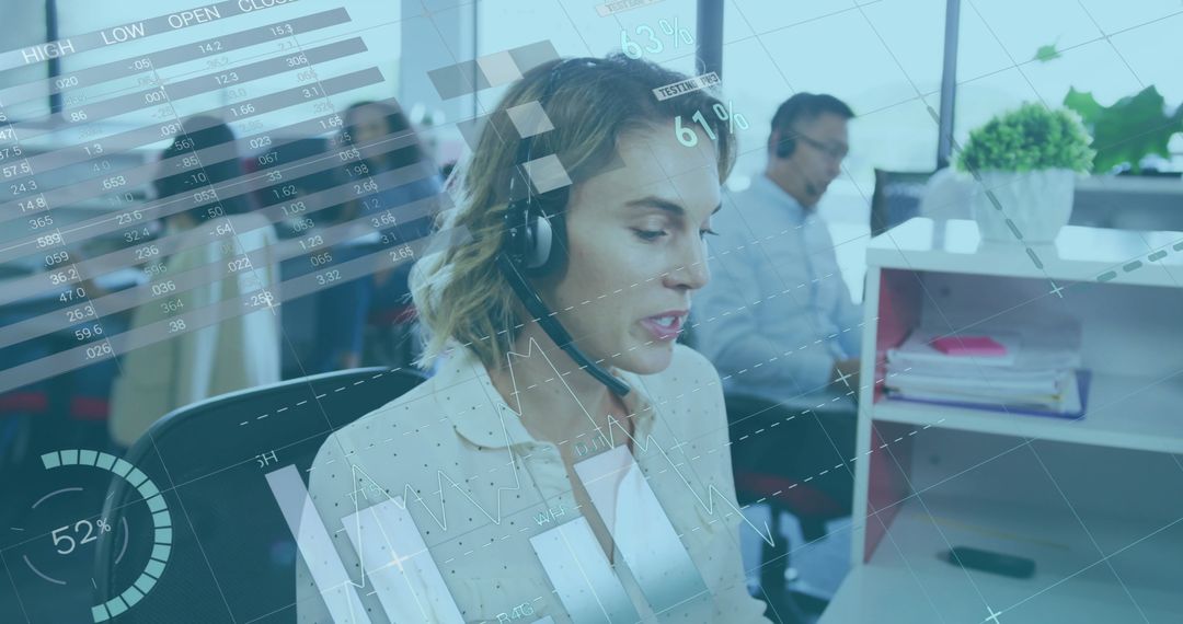 Businesswoman Analyzing Data While Using Headset in Office