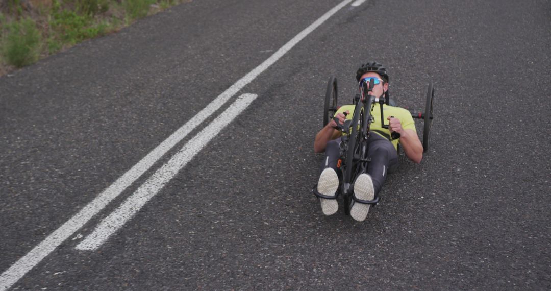 Athlete Riding Handcycle on Open Road - Free Images, Stock Photos and Pictures on Pikwizard.com