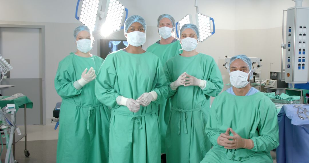 Medical Team in Surgical Theater Wearing Protective Gear - Free Images, Stock Photos and Pictures on Pikwizard.com