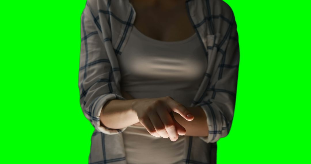 Mid section of woman using invisible screen against green screen - Free Images, Stock Photos and Pictures on Pikwizard.com