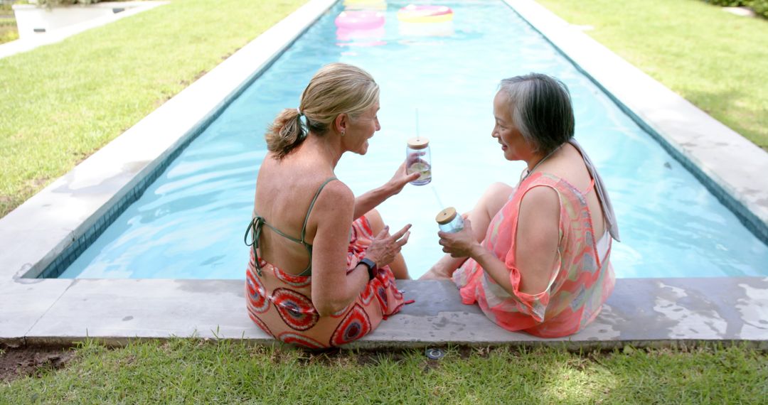 Diverse Friends Relaxing and Socializing by Poolside