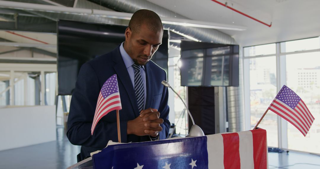 African American Man Giving Motivational Speech at Podium with American Flags - Free Images, Stock Photos and Pictures on Pikwizard.com