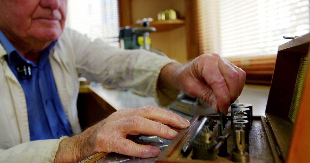 Horologist Repairing Watch in Workshop with Precision Tools