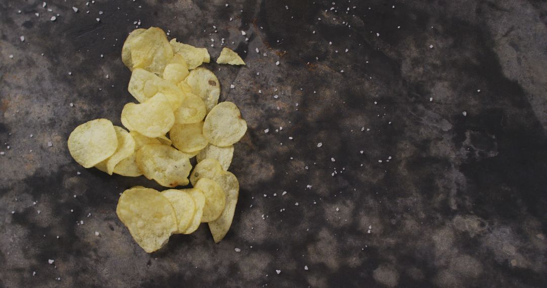 Pile of Crunchy Potato Chips Scattered on Dark Surface - Free Images, Stock Photos and Pictures on Pikwizard.com