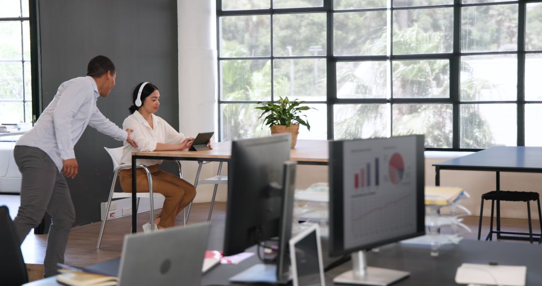 Multiracial Colleagues Collaborate in Modern Office Environment
