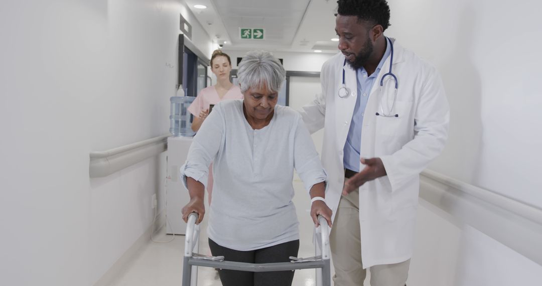 Doctor Assisting Senior Woman Walking With Zimmer Frame In Hospital - Free Images, Stock Photos and Pictures on Pikwizard.com