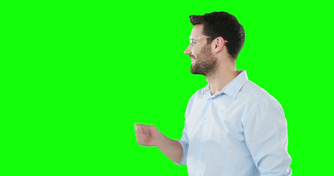 Man Interacting with Virtual Interface on Green Screen Background