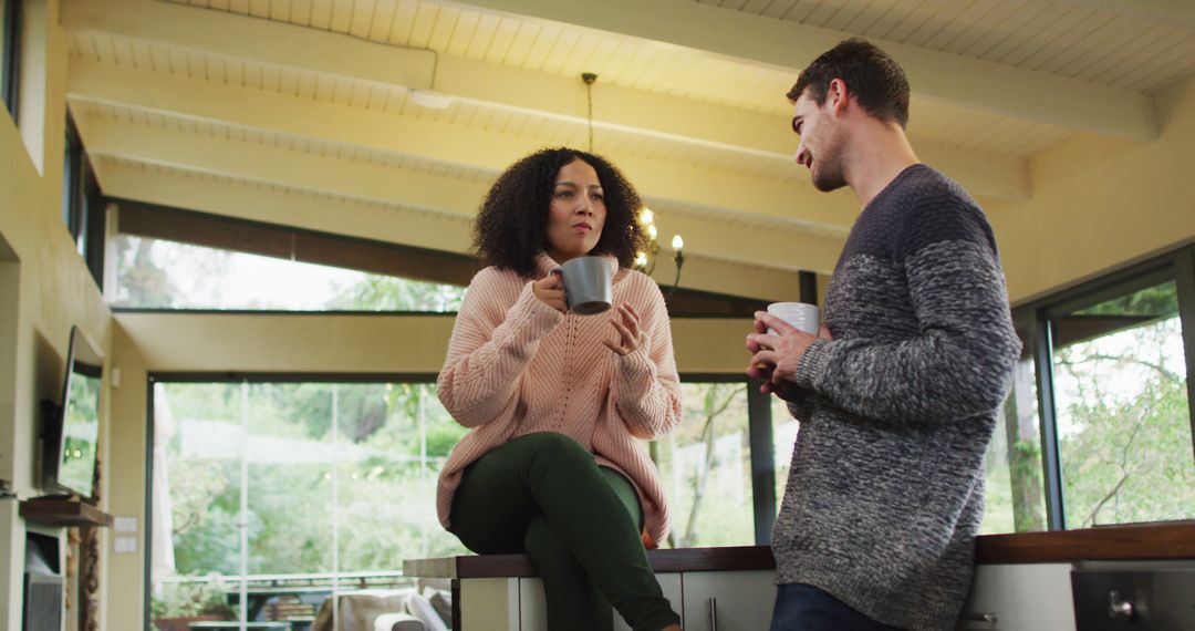 Relaxed Couple Enjoying Coffee in Bright Modern Kitchen