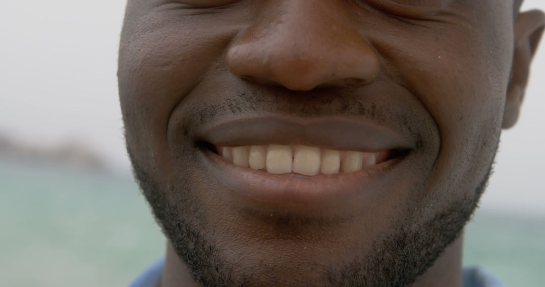 Close-Up of Smiling African American Man at Beach