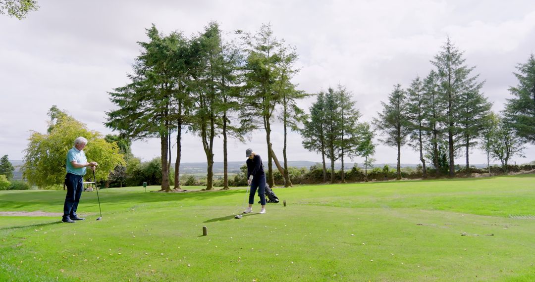 Senior Couple Enjoying Golf Together on Scenic Course
