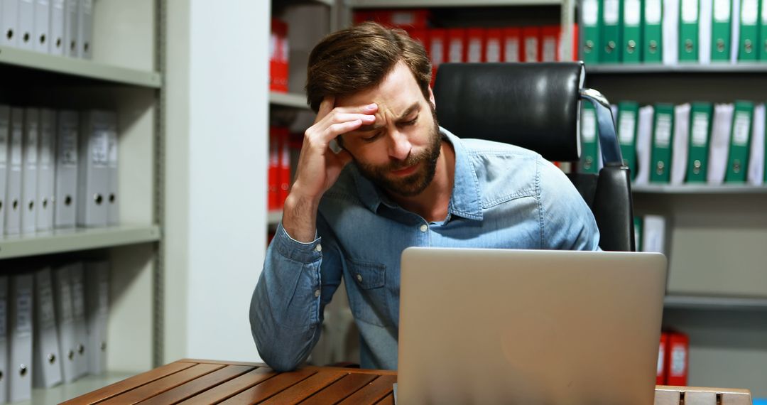 Stressed Office Worker Struggling with Mental Fatigue at Desk - Free Images, Stock Photos and Pictures on Pikwizard.com