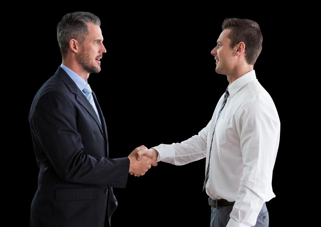 Business men shaking hands against black background - Free Images, Stock Photos and Pictures on Pikwizard.com