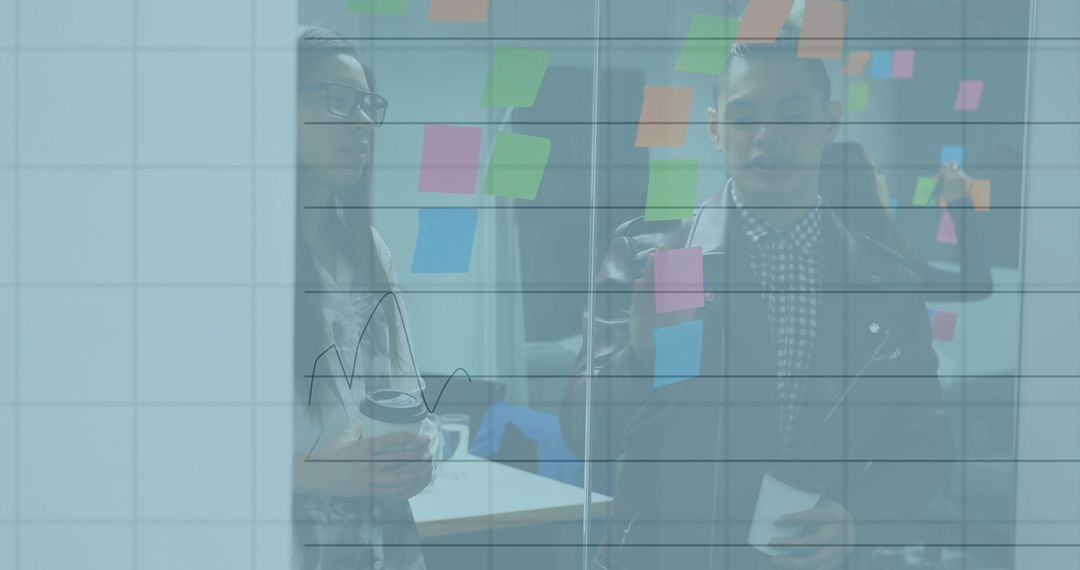 Innovative Team Collaborating on Strategic Planning with Sticky Notes