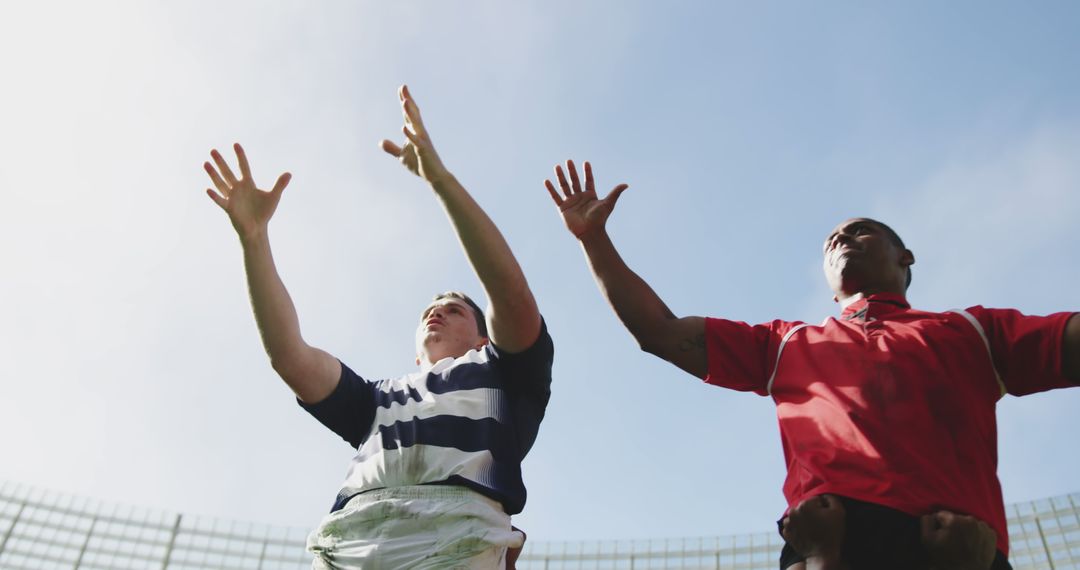 Low Angle View of Rugby Players Competing Under Clear Sky - Free Images, Stock Photos and Pictures on Pikwizard.com