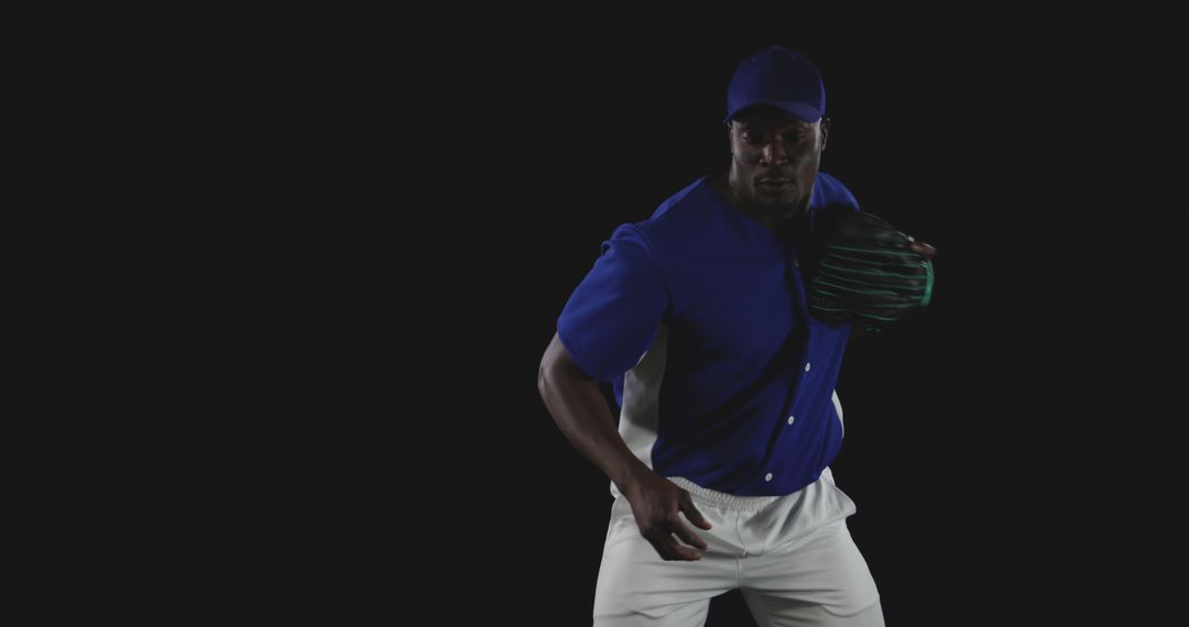 Professional Baseball Player in Action Pose on Black Background - Free Images, Stock Photos and Pictures on Pikwizard.com