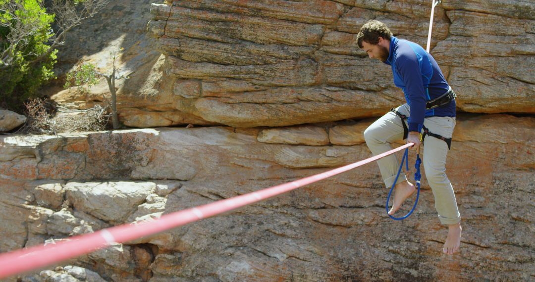 Man Balancing on Tightrope Across Rocky Canyon - Free Images, Stock Photos and Pictures on Pikwizard.com