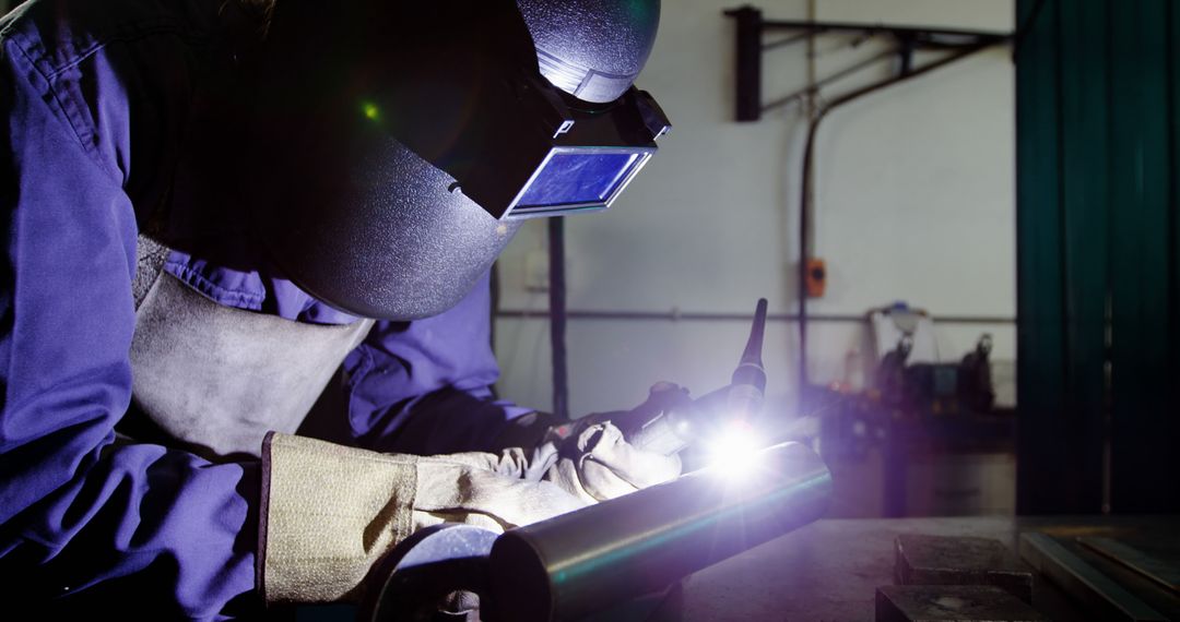 Welder Performing Task in Industrial Workshop with Protective Gear - Free Images, Stock Photos and Pictures on Pikwizard.com