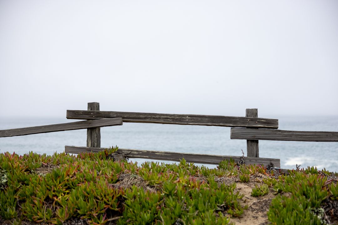 Rustic Wooden Fence Overlooking Foggy Ocean