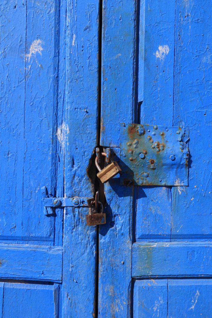 Weathered blue wooden door with padlock - Free Images, Stock Photos and Pictures on Pikwizard.com