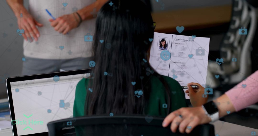 Candidate Wearing Green Blouse Holding Resume in Office Setting